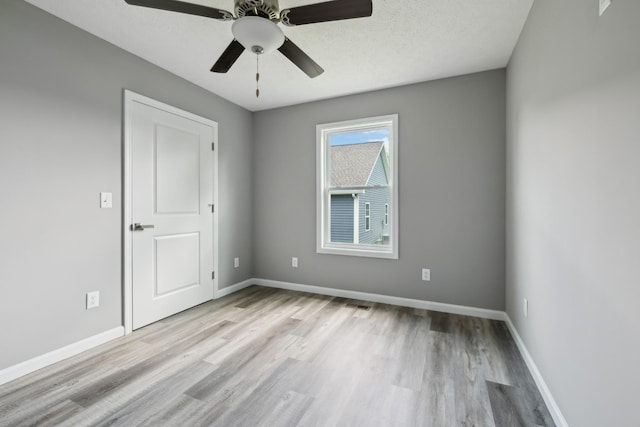 605 Poplar St, Lafayette, TN 37083 - empty room with a ceiling fan, baseboards, visible vents, and wood finished floors