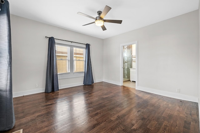 spare room featuring baseboards, a ceiling fan, and wood finished floors