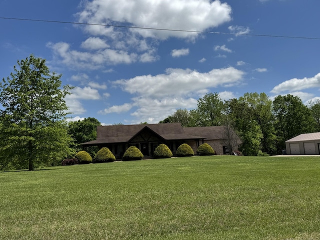 view of front of home with a garage and a front yard