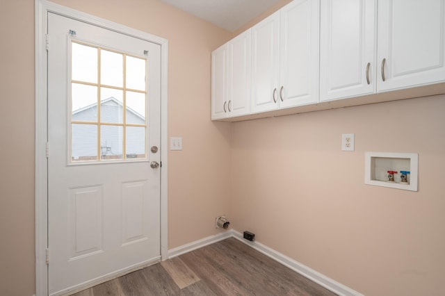 143 Willdon Dr, Portland, TN 37148 - laundry room with baseboards, hookup for a washing machine, cabinet space, and wood finished floors
