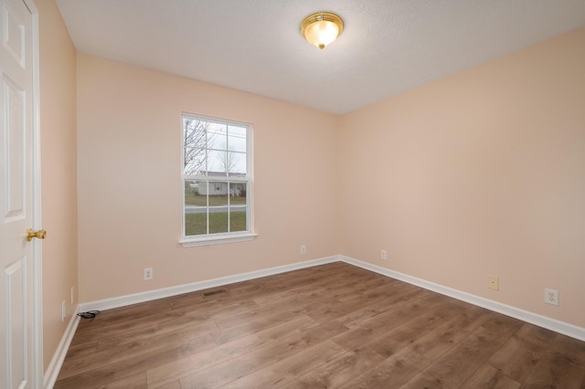 143 Willdon Dr, Portland, TN 37148 - unfurnished room with baseboards, wood finished floors, and visible vents