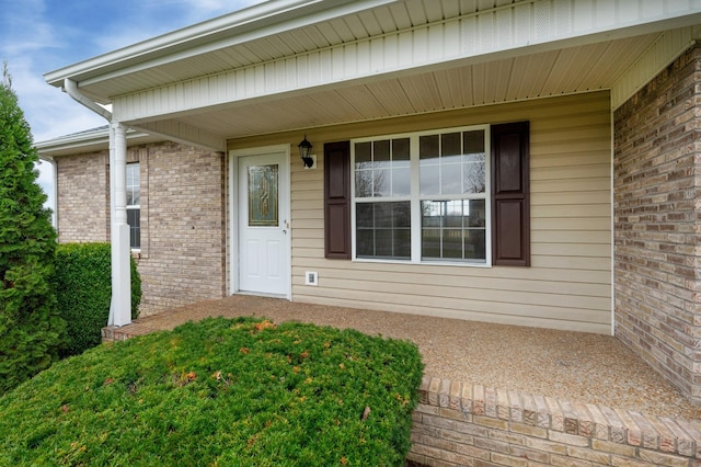 143 Willdon Dr, Portland, TN 37148 - doorway to property featuring a porch and brick siding