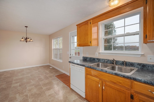 143 Willdon Dr, Portland, TN 37148 - kitchen featuring an inviting chandelier, dark countertops, baseboards, a sink, and dishwasher