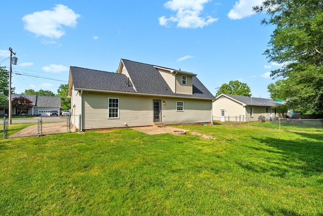 back of property featuring a fenced backyard, a gate, a lawn, and a patio area