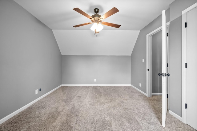 bonus room featuring baseboards, ceiling fan, carpet, and vaulted ceiling