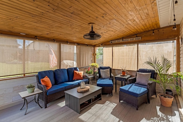 sunroom featuring an outdoor living space and a healthy amount of sunlight