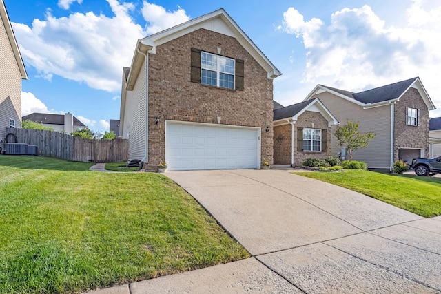 traditional-style home featuring brick siding, a garage, fence, and driveway