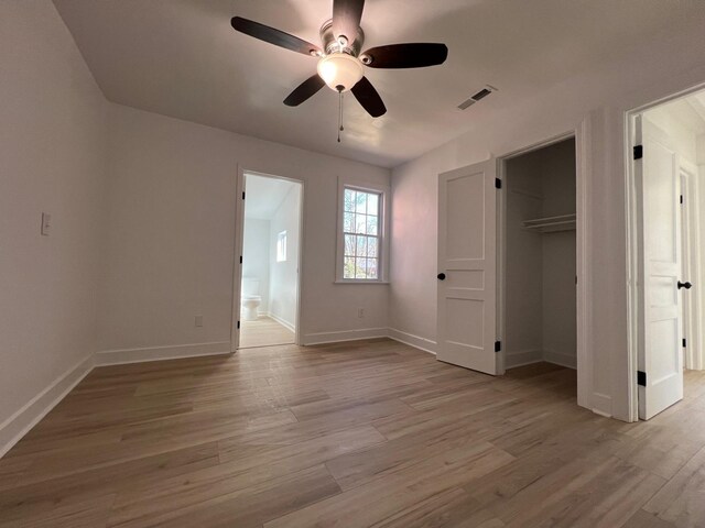 419 Hawkins Ave, Murfreesboro, TN 37130 - unfurnished bedroom with visible vents, light wood-type flooring, baseboards, a closet, and connected bathroom