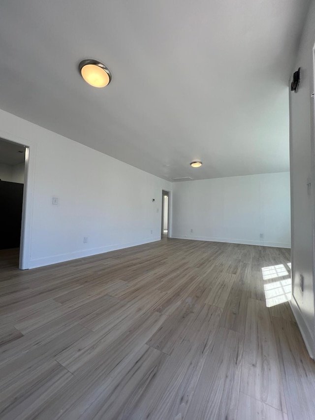 419 Hawkins Ave, Murfreesboro, TN 37130 - unfurnished living room featuring baseboards and wood finished floors