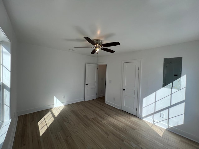 419 Hawkins Ave, Murfreesboro, TN 37130 - unfurnished room with a healthy amount of sunlight, ceiling fan, electric panel, and wood finished floors