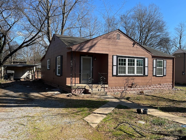 419 Hawkins Ave, Murfreesboro, TN 37130 - bungalow-style house featuring roof with shingles, a storage unit, an outdoor structure, and crawl space