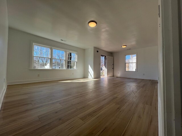419 Hawkins Ave, Murfreesboro, TN 37130 - unfurnished living room featuring baseboards, visible vents, and wood finished floors