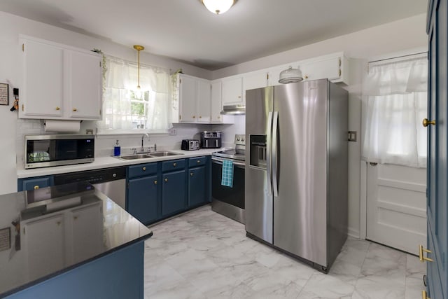kitchen featuring a sink, marble finish floor, under cabinet range hood, and stainless steel appliances