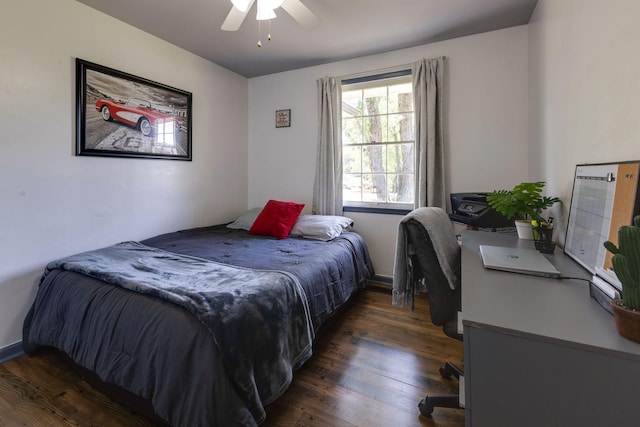 bedroom with ceiling fan and wood finished floors
