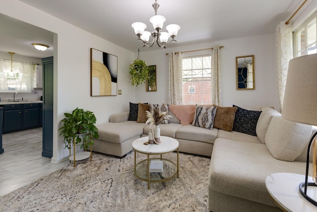 living area with an inviting chandelier