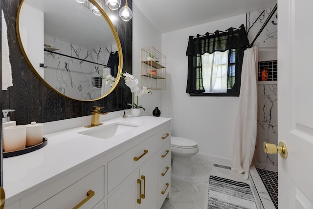 bathroom with vanity, visible vents, toilet, baseboards, and a marble finish shower