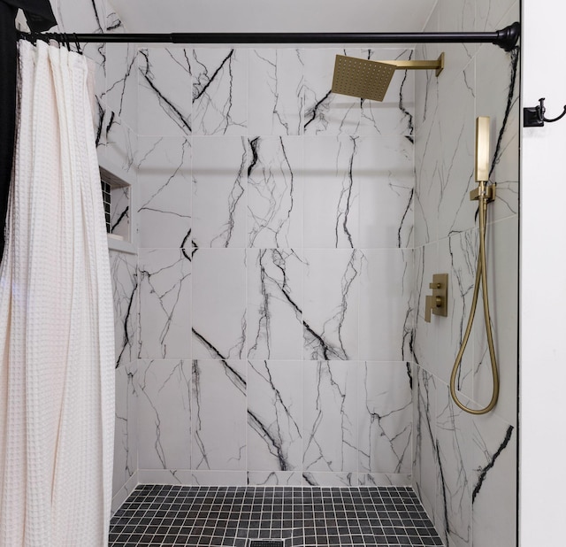full bathroom with a marble finish shower