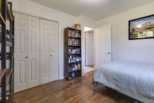 bedroom featuring a closet and wood finished floors