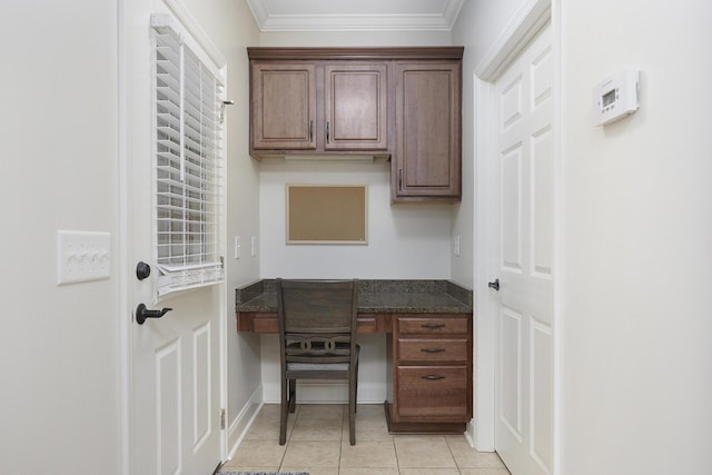 office featuring built in study area, baseboards, crown molding, and light tile patterned floors