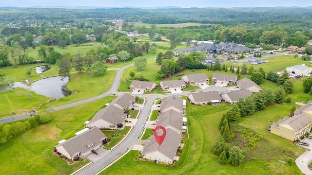 drone / aerial view with a residential view and a water view