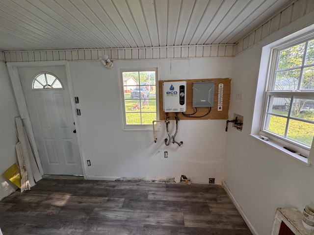laundry room featuring wooden ceiling, tankless water heater, and wood finished floors