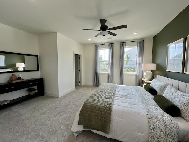 carpeted bedroom featuring recessed lighting, baseboards, visible vents, and a ceiling fan