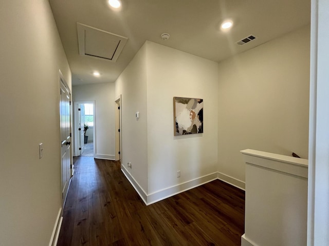 corridor featuring recessed lighting, baseboards, visible vents, and dark wood-style floors