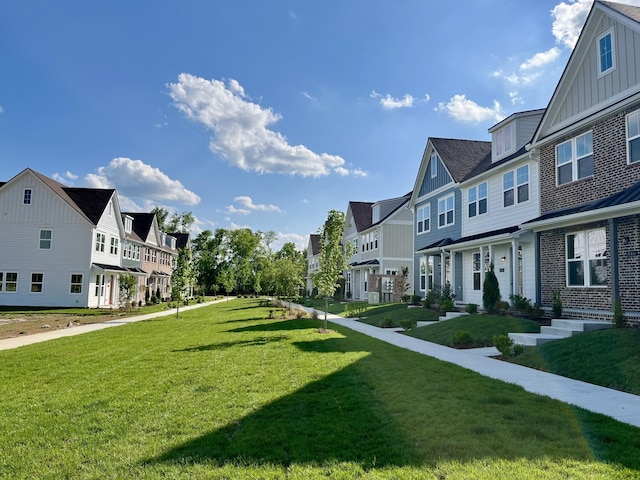 view of home's community featuring a lawn and a residential view