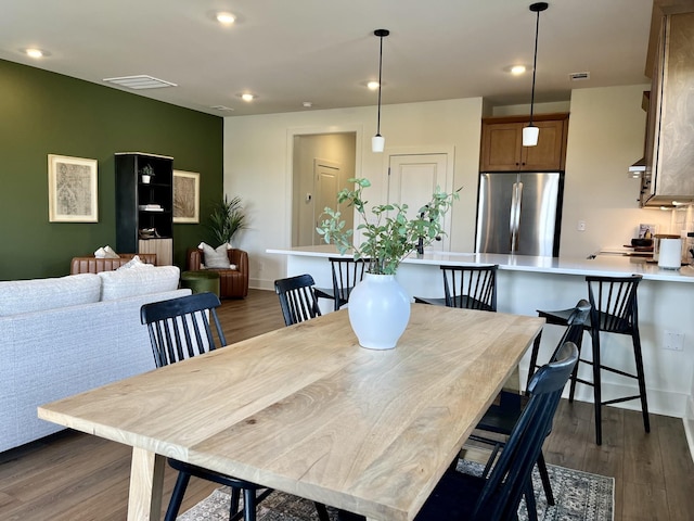 dining room featuring recessed lighting, visible vents, and dark wood-style floors