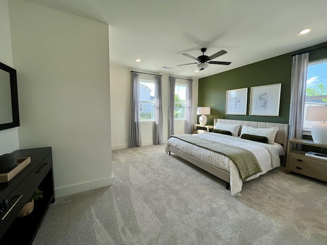carpeted bedroom featuring visible vents, recessed lighting, baseboards, and ceiling fan