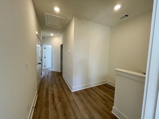 corridor featuring baseboards, dark wood-type flooring, recessed lighting, and visible vents