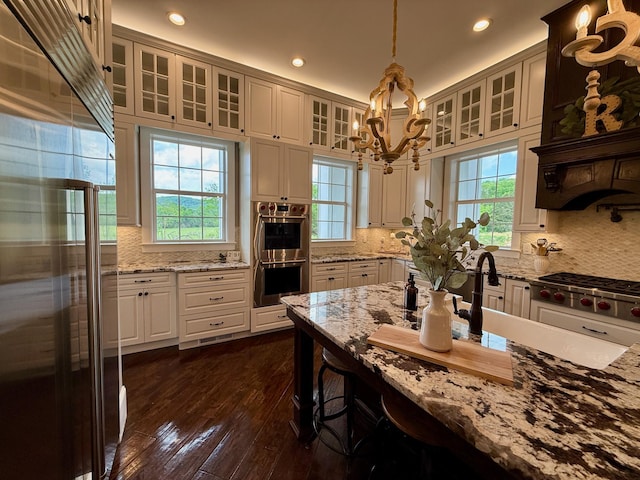 kitchen with recessed lighting, appliances with stainless steel finishes, and a healthy amount of sunlight