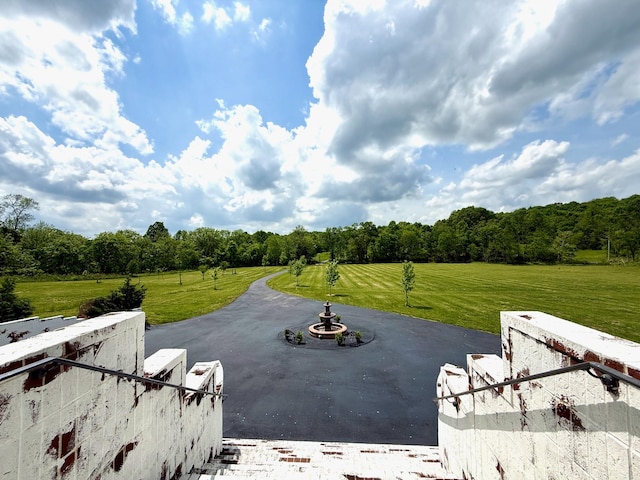 exterior space featuring a wooded view
