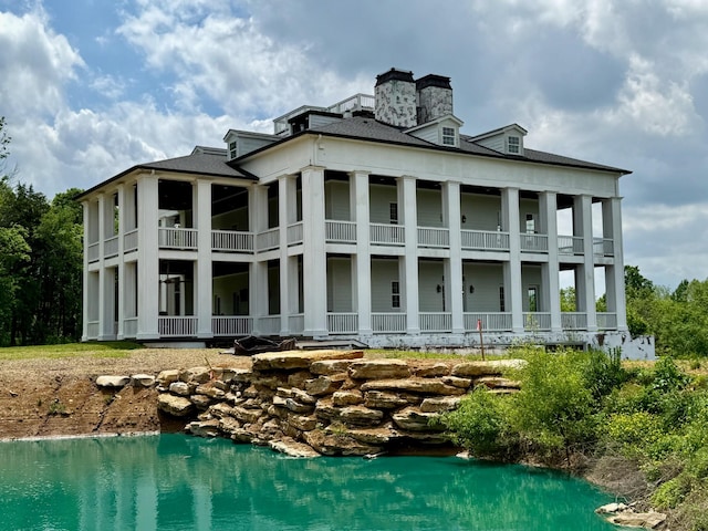 rear view of house with a balcony