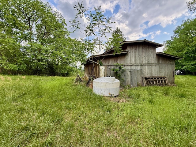 view of side of property with a barn and an outdoor structure