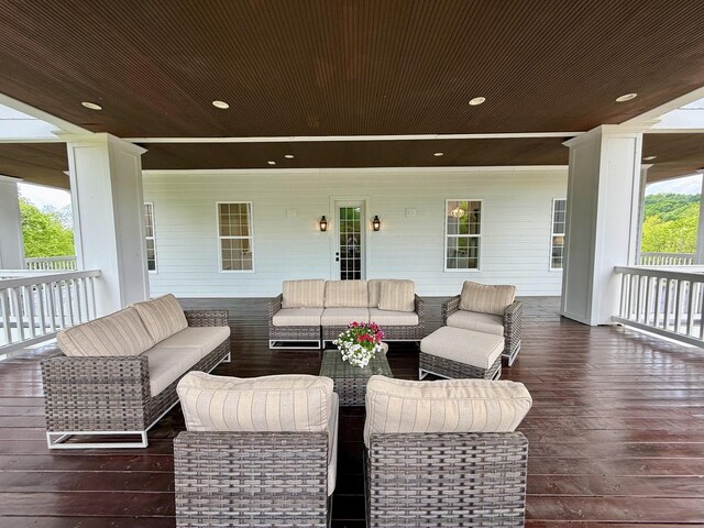 wooden terrace featuring outdoor lounge area