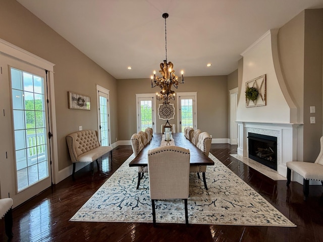 dining space with an inviting chandelier, baseboards, recessed lighting, and dark wood-type flooring