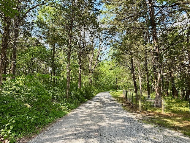 view of street featuring a forest view