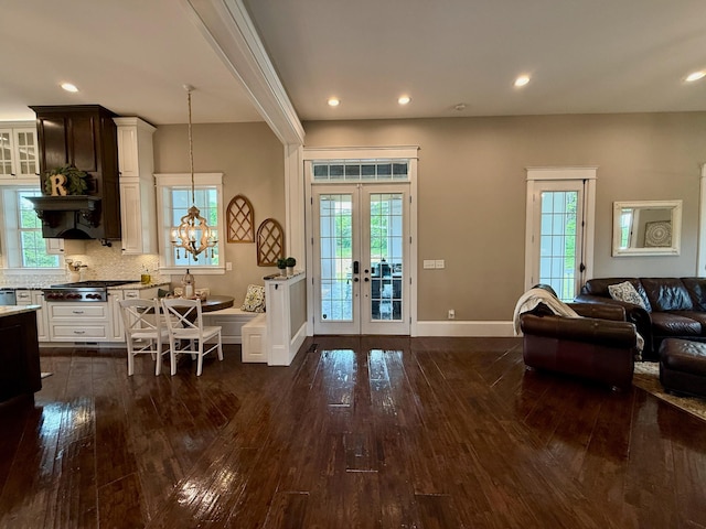 interior space with dark wood-style flooring, baseboards, recessed lighting, and french doors