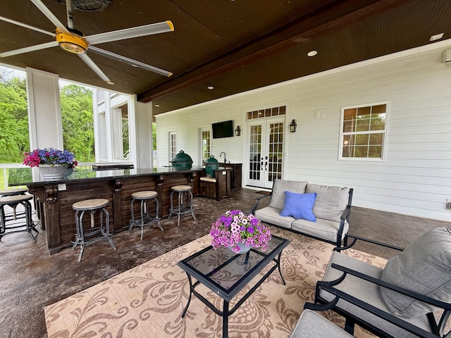 view of patio featuring french doors, outdoor dry bar, a ceiling fan, and outdoor lounge area