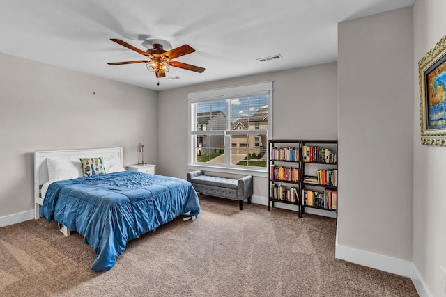 bedroom with baseboards, a ceiling fan, carpet, and visible vents