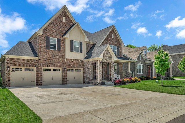 craftsman-style home with board and batten siding, roof with shingles, brick siding, a front lawn, and concrete driveway