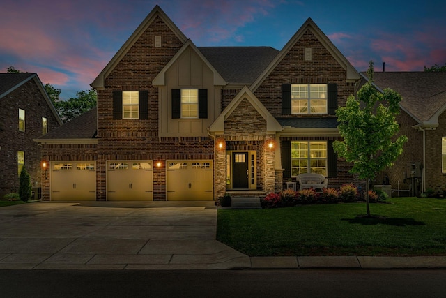 craftsman inspired home featuring board and batten siding, driveway, brick siding, a front lawn, and a shingled roof