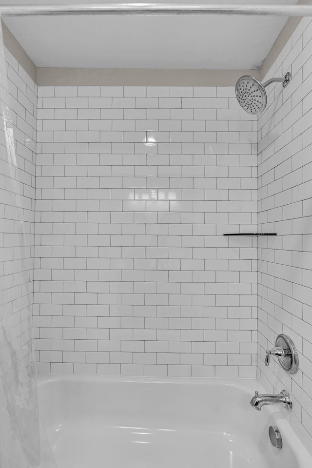 bathroom featuring  shower combination