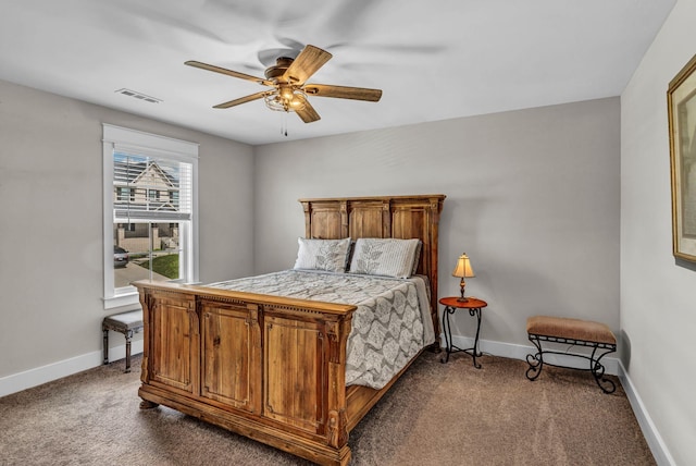 bedroom featuring visible vents, baseboards, and dark colored carpet