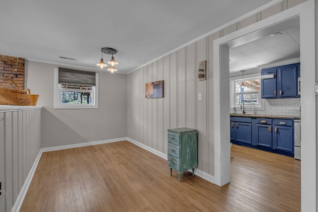2075 Buttrey Rd, Bon Aqua, TN 37025 - unfurnished room featuring baseboards, visible vents, ornamental molding, and light wood-style floors