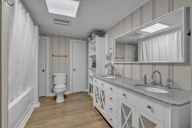 2075 Buttrey Rd, Bon Aqua, TN 37025 - bathroom featuring double vanity, toilet, visible vents, and a sink