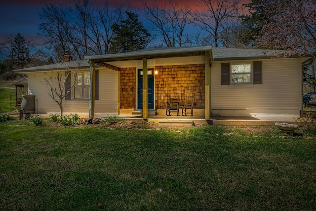 2075 Buttrey Rd, Bon Aqua, TN 37025 - view of front facade featuring covered porch, a chimney, and a front yard