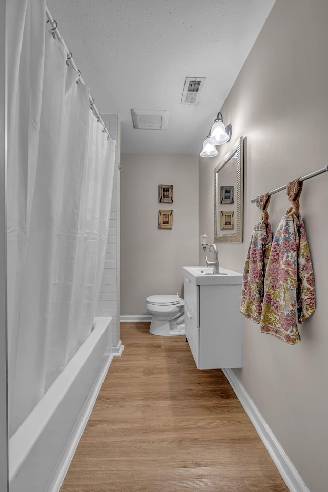 2075 Buttrey Rd, Bon Aqua, TN 37025 - bathroom featuring vanity, toilet, baseboards, wood finished floors, and visible vents