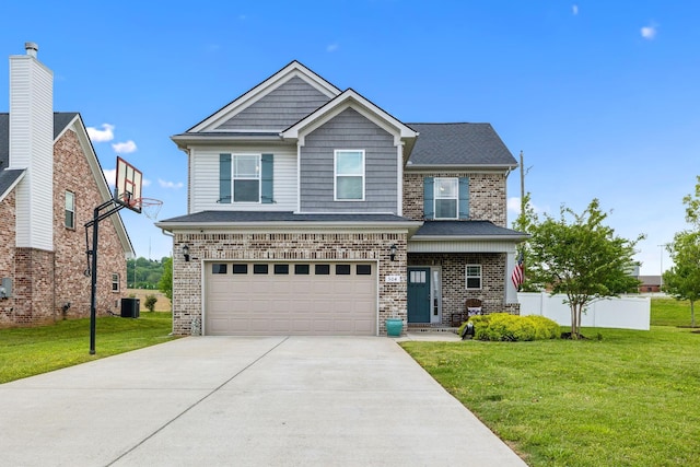 craftsman-style house featuring brick siding, an attached garage, driveway, and a front yard